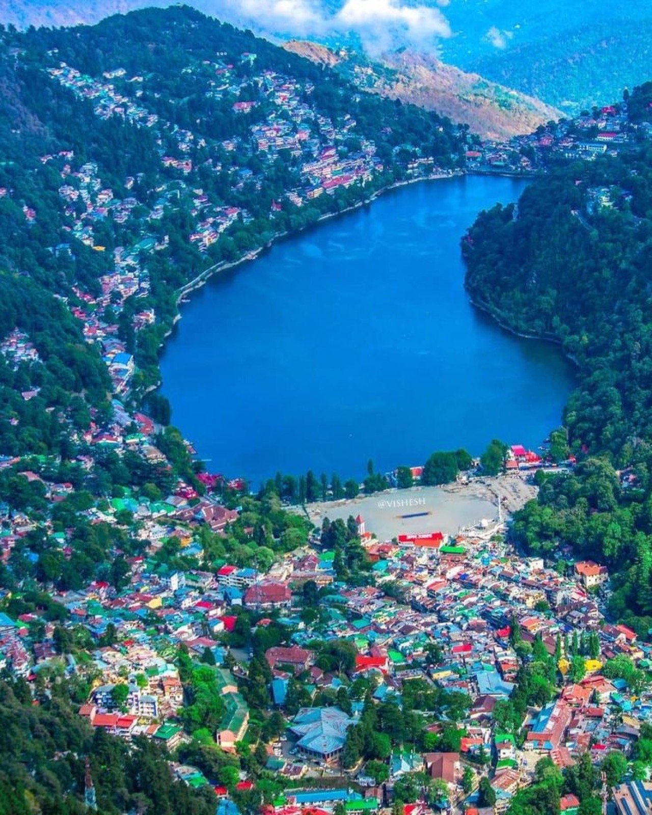 Naini Lake at dusk with hills behind