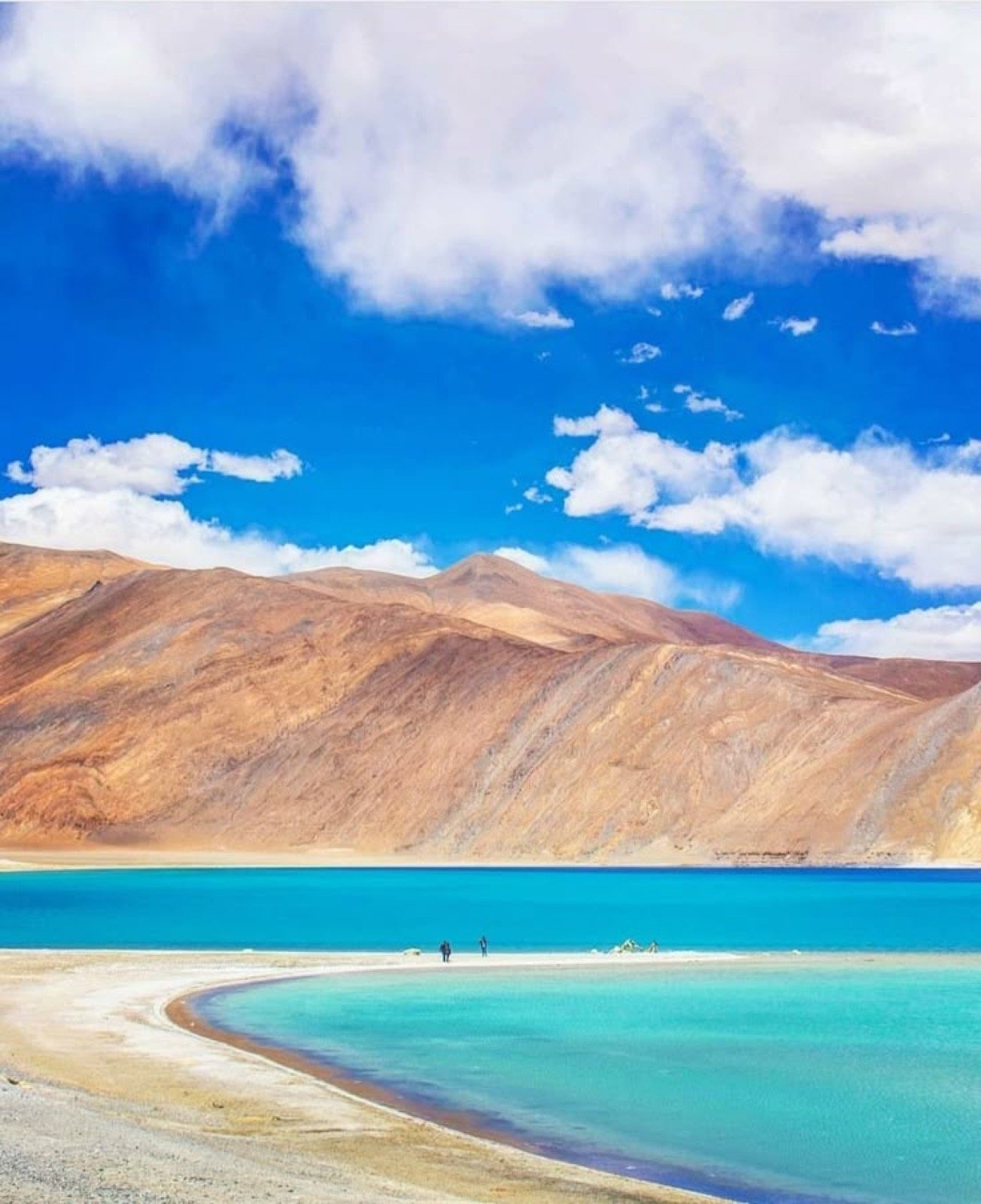 Pangong Tso turquoise water with mountain reflections